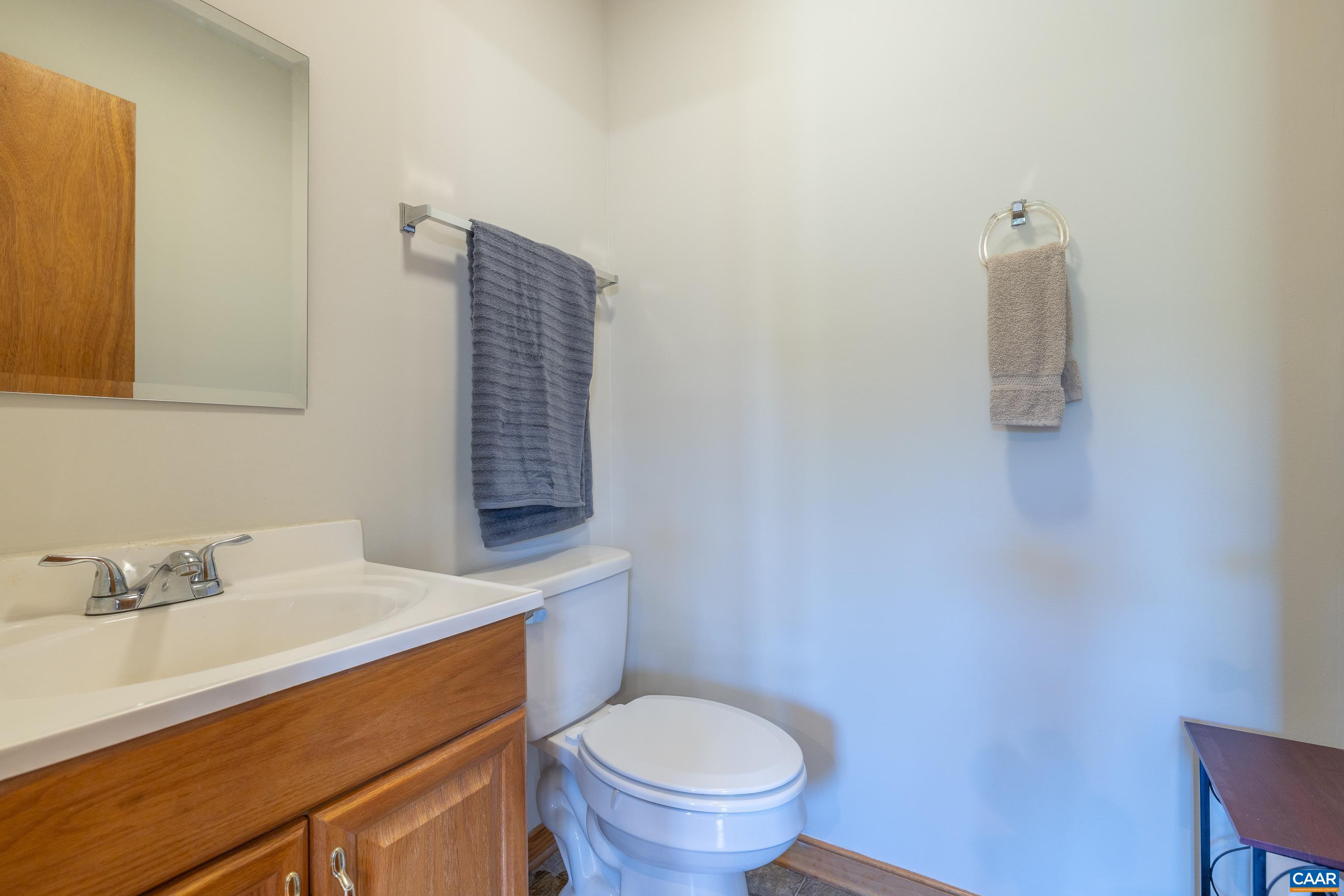 7839 Venable Road Kents Store, VA 23084 - Photo 35 of 51 a bathroom with a sink a toilet and mirror