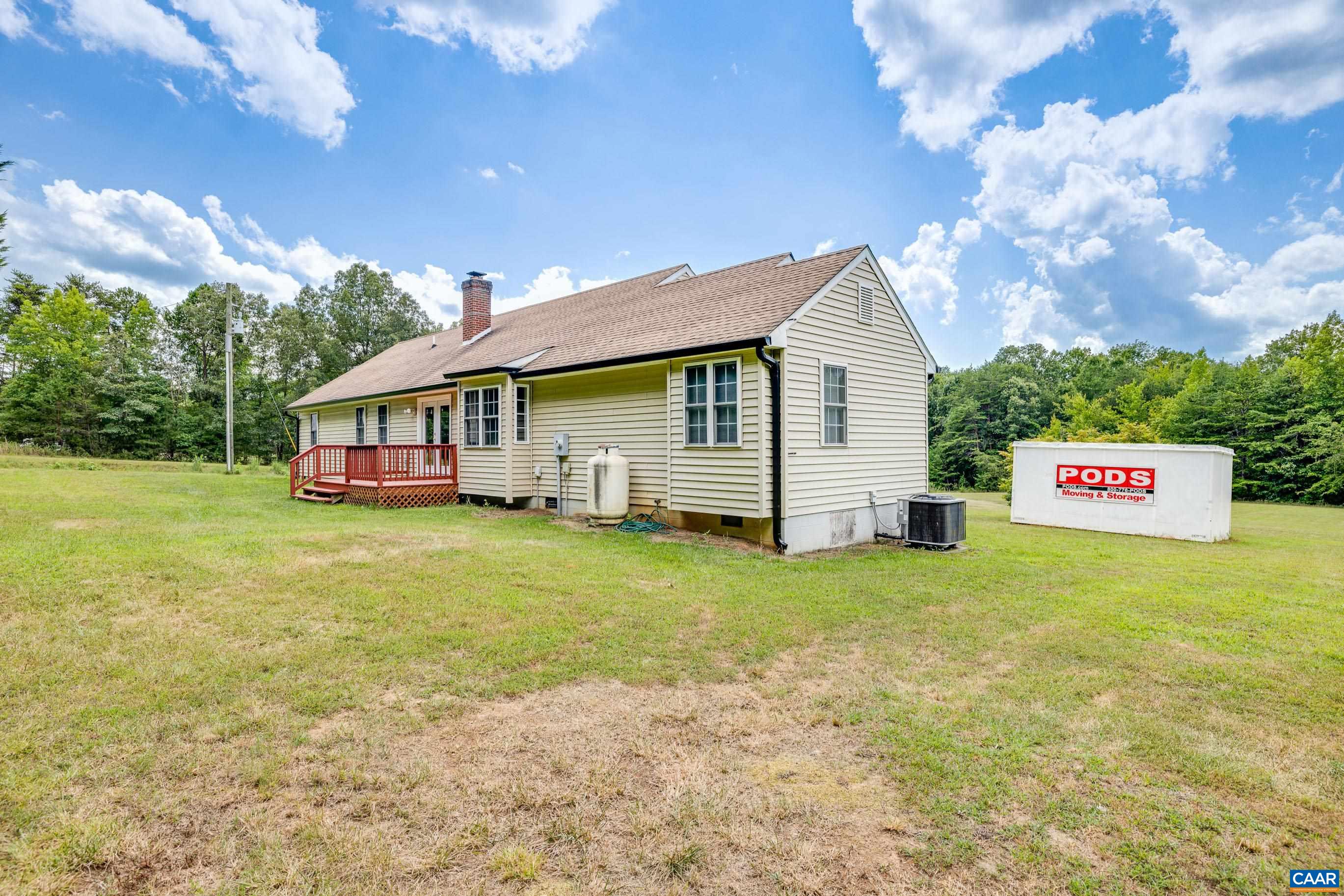 7839 Venable Road Kents Store, VA 23084 - Photo 39 of 51 a front view of house with yard and trees in the background