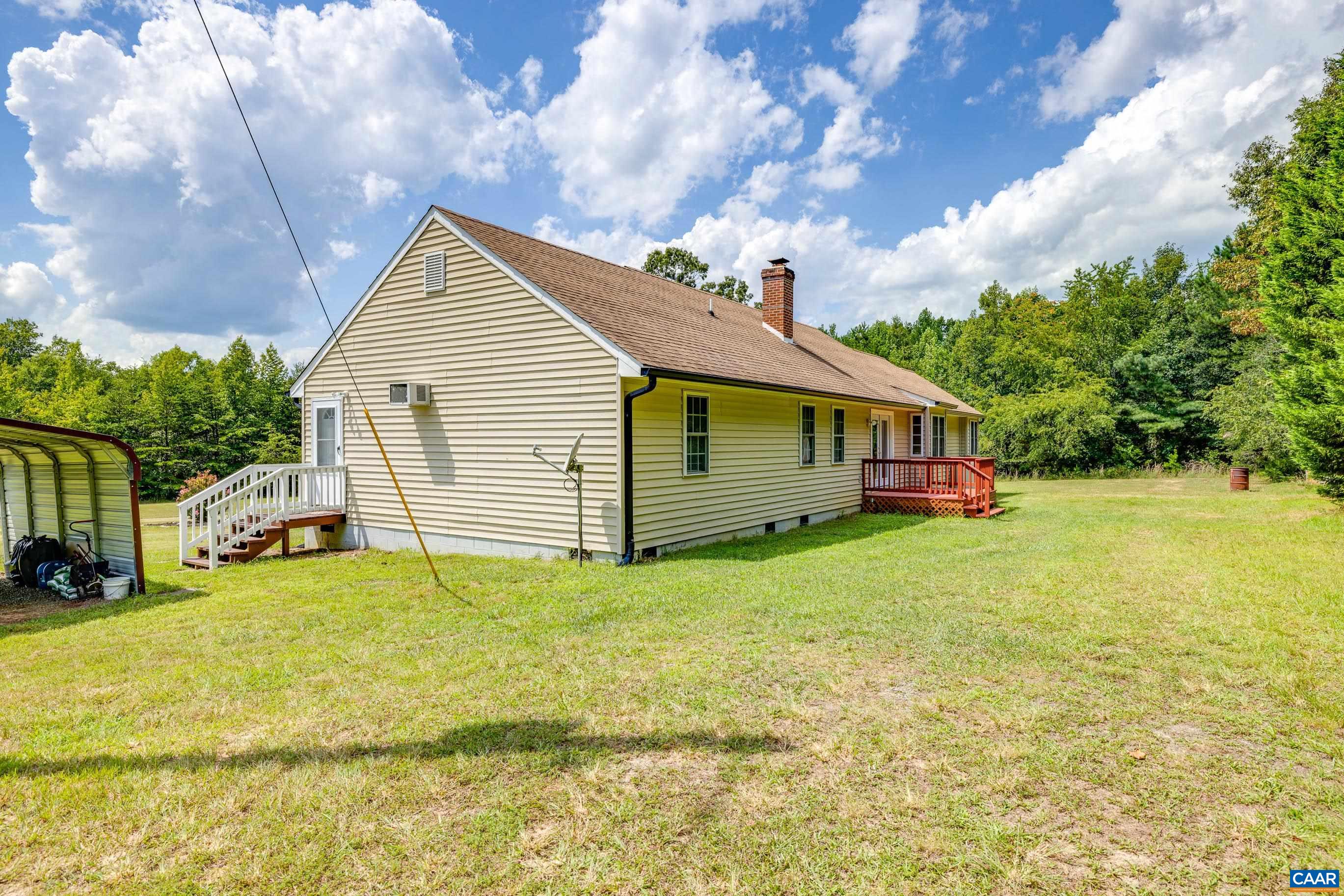 7839 Venable Road Kents Store, VA 23084 - Photo 40 of 51 a view of a house with backyard porch and garden