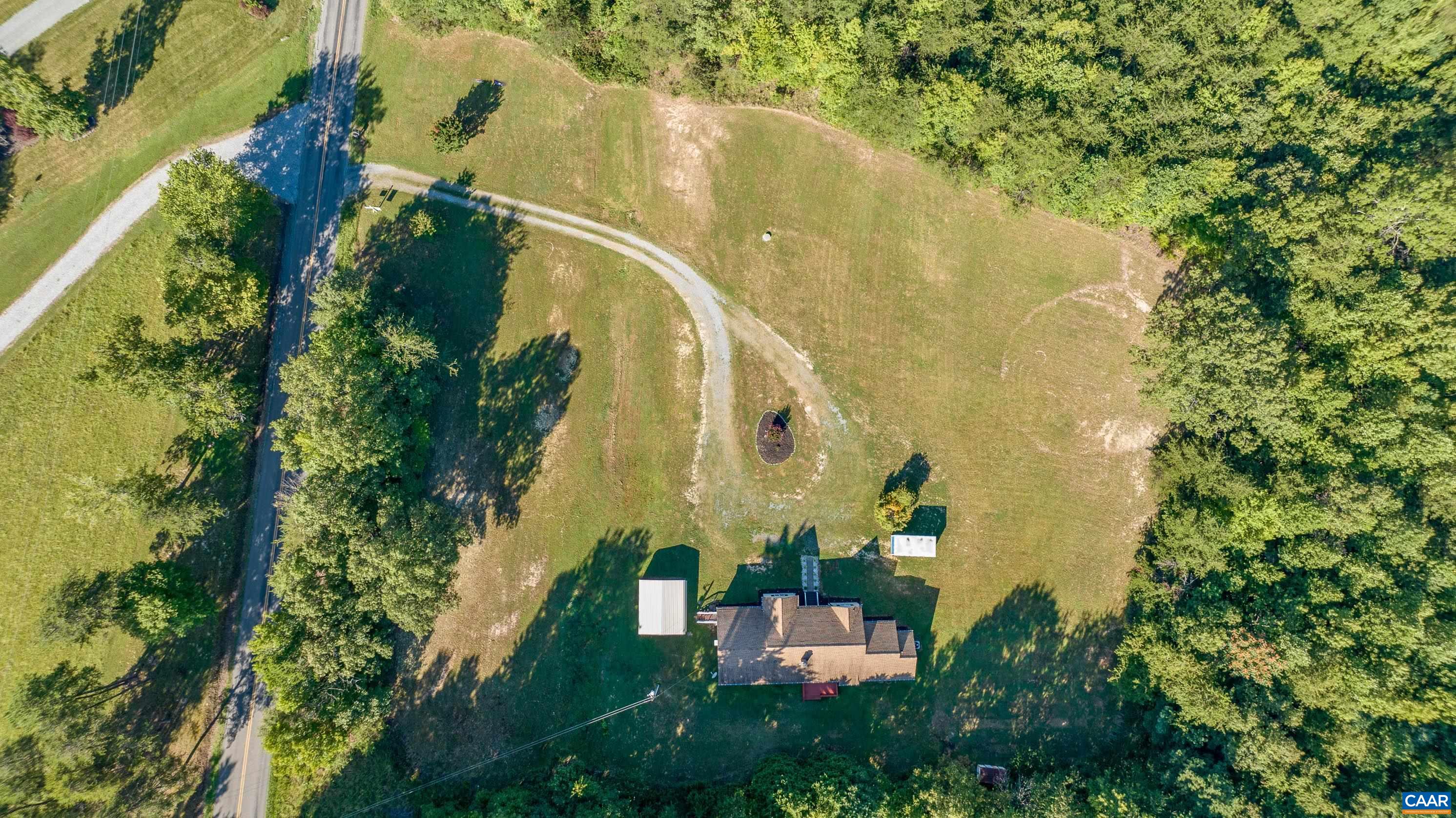 7839 Venable Road Kents Store, VA 23084 - Photo 44 of 51 an aerial view of residential house with outdoor space and trees around
