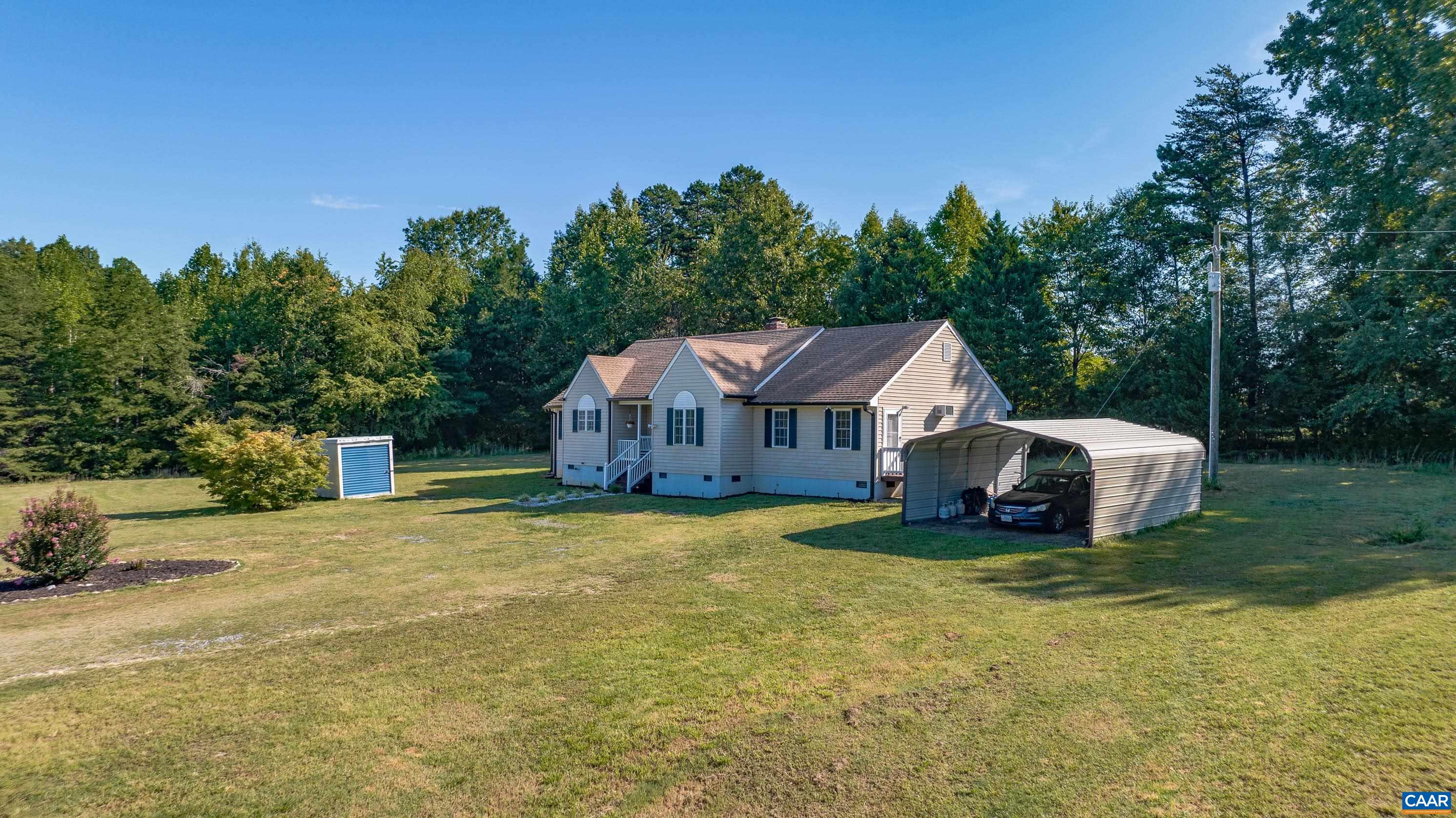 7839 Venable Road Kents Store, VA 23084 - Photo 47 of 51 a house with trees in the background