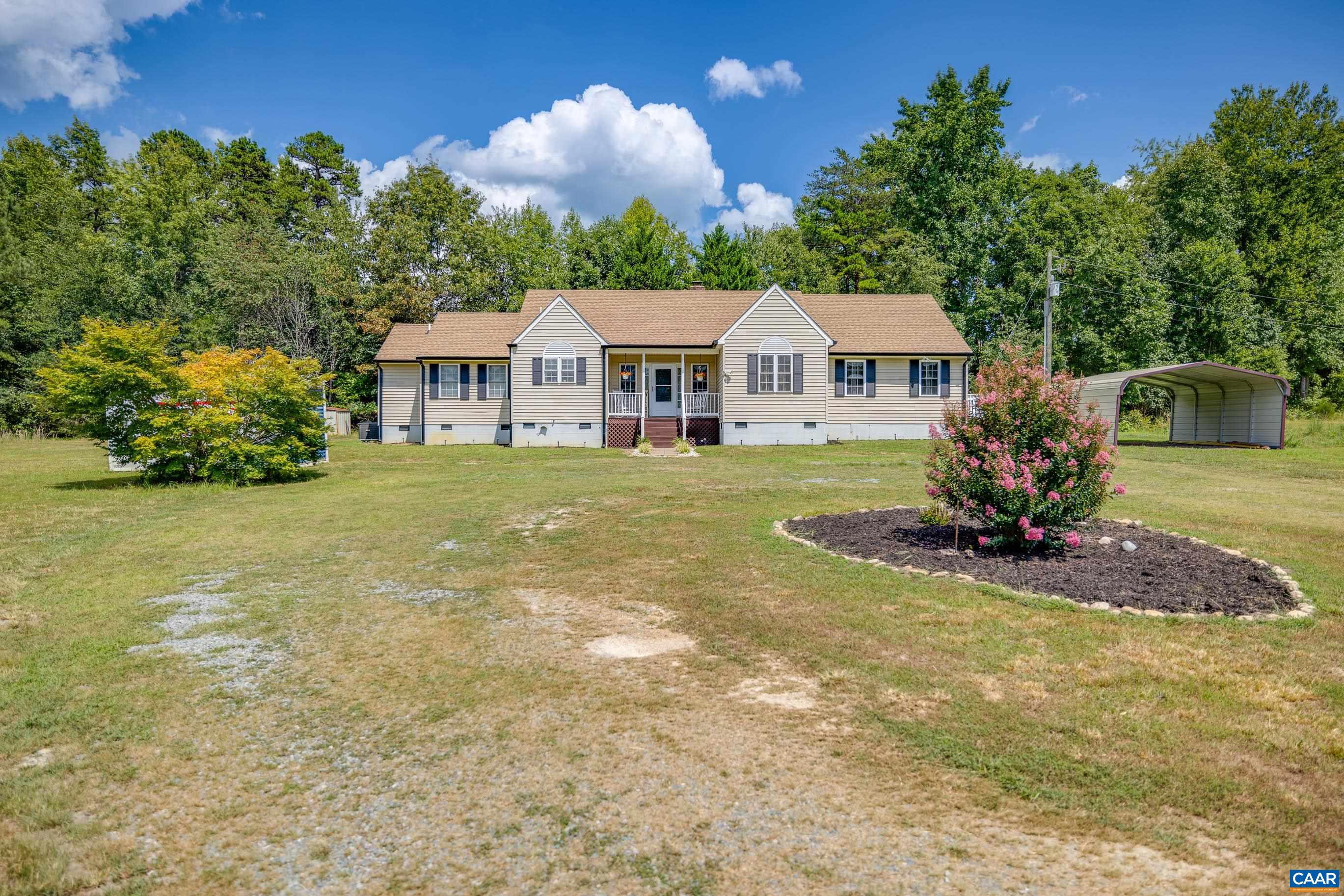 7839 Venable Road Kents Store, VA 23084 - Photo 49 of 51 a view of a house with a big yard and potted plants in front of it