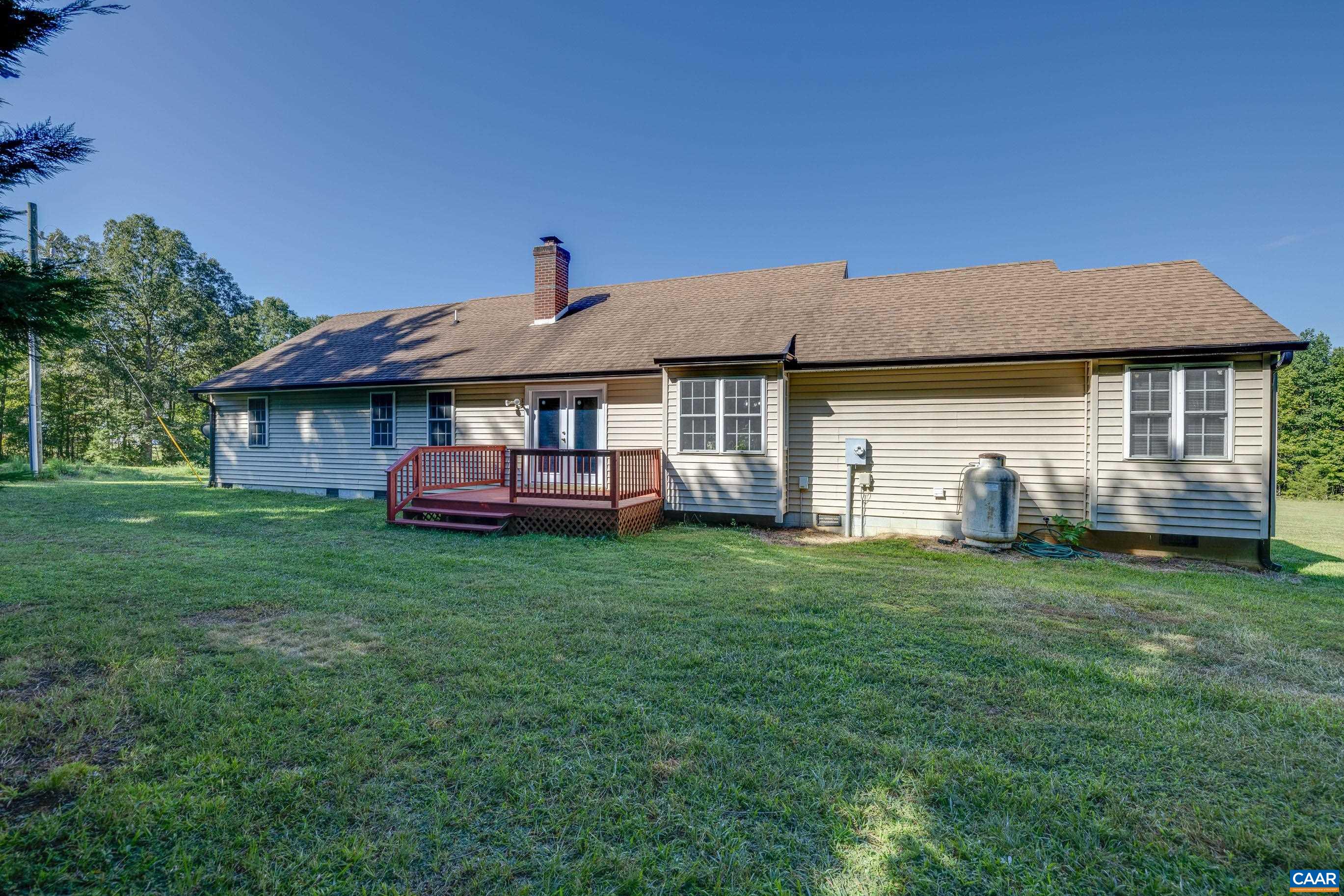 7839 Venable Road Kents Store, VA 23084 - Photo 6 of 51 a front view of a house with a garden