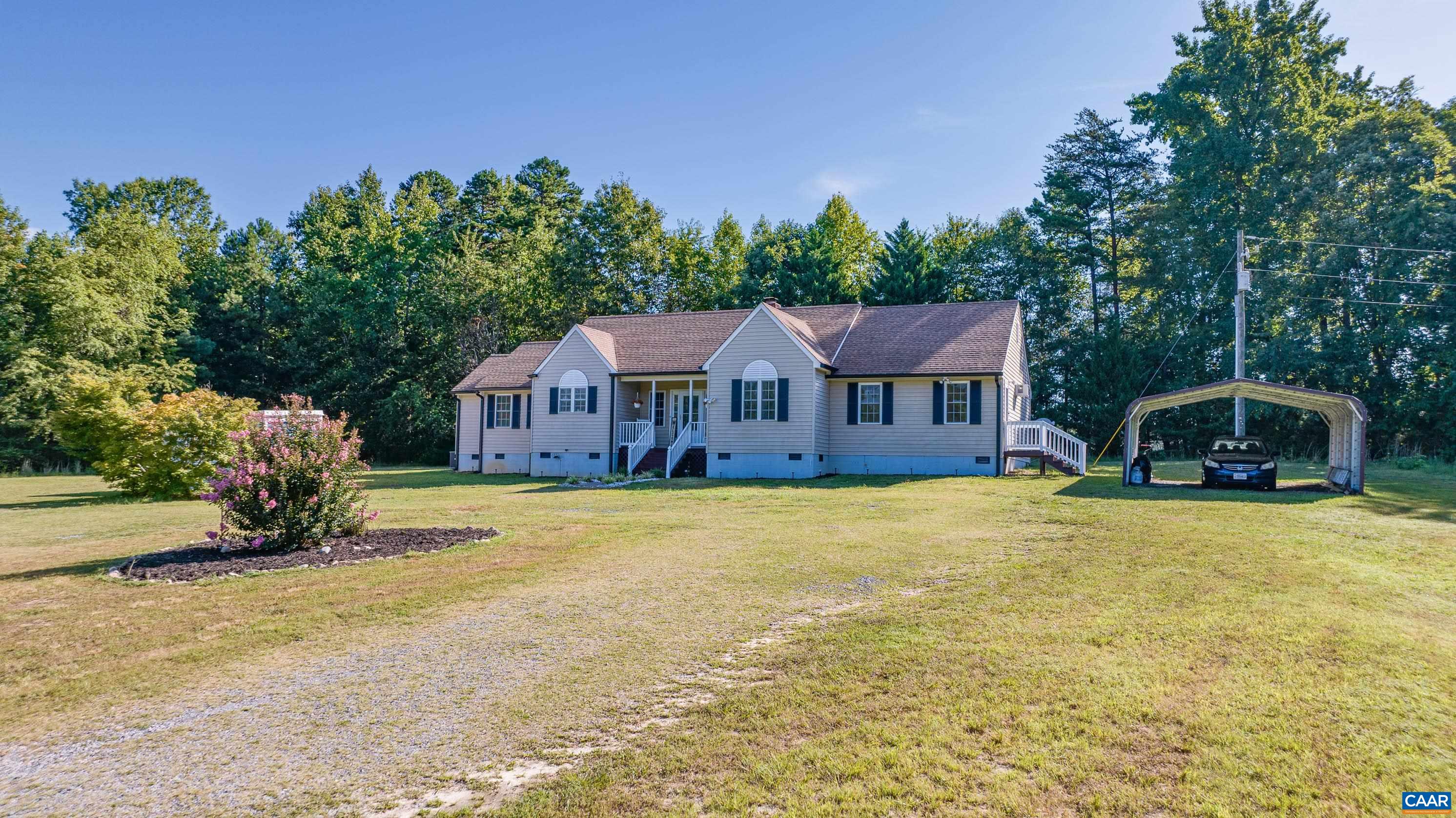 7839 Venable Road Kents Store, VA 23084 - Photo 9 of 51 a front view of a house with a garden