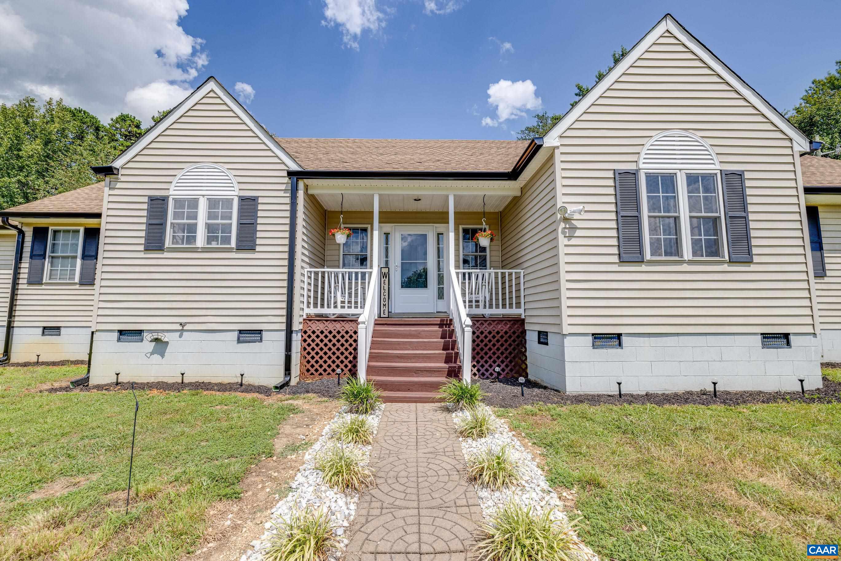 7839 Venable Road Kents Store, VA 23084 - Photo 10 of 51 a front view of a house with garden