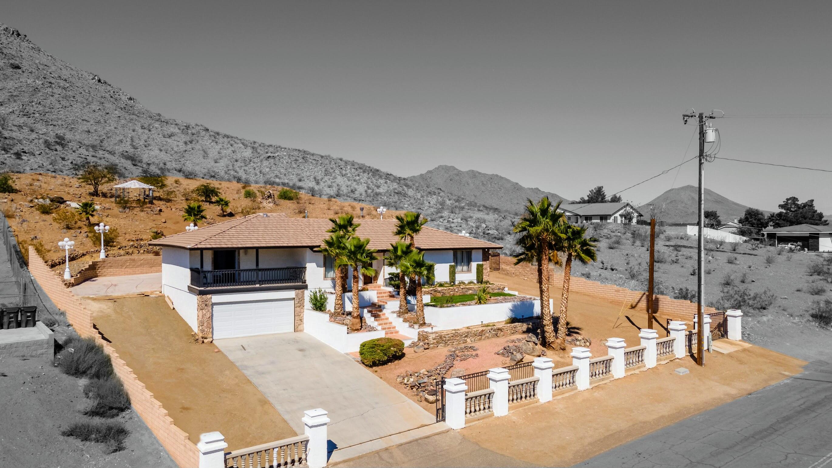 16276 Rancherias Road Apple Valley, CA 92307 - Photo 2 of 27 a view of a patio with a table and chairs