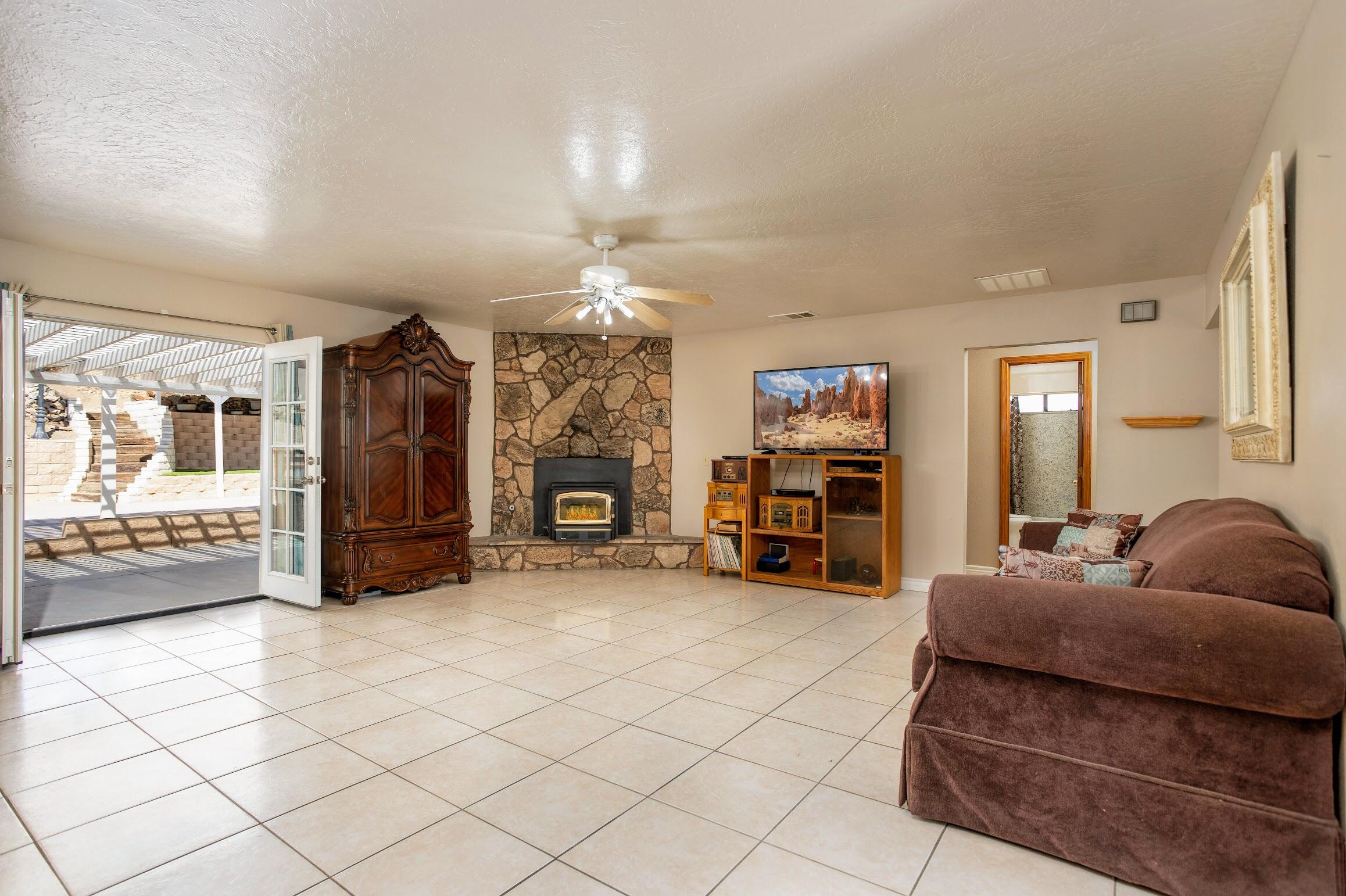 16276 Rancherias Road Apple Valley, CA 92307 - Photo 13 of 27 a living room with furniture and a chandelier