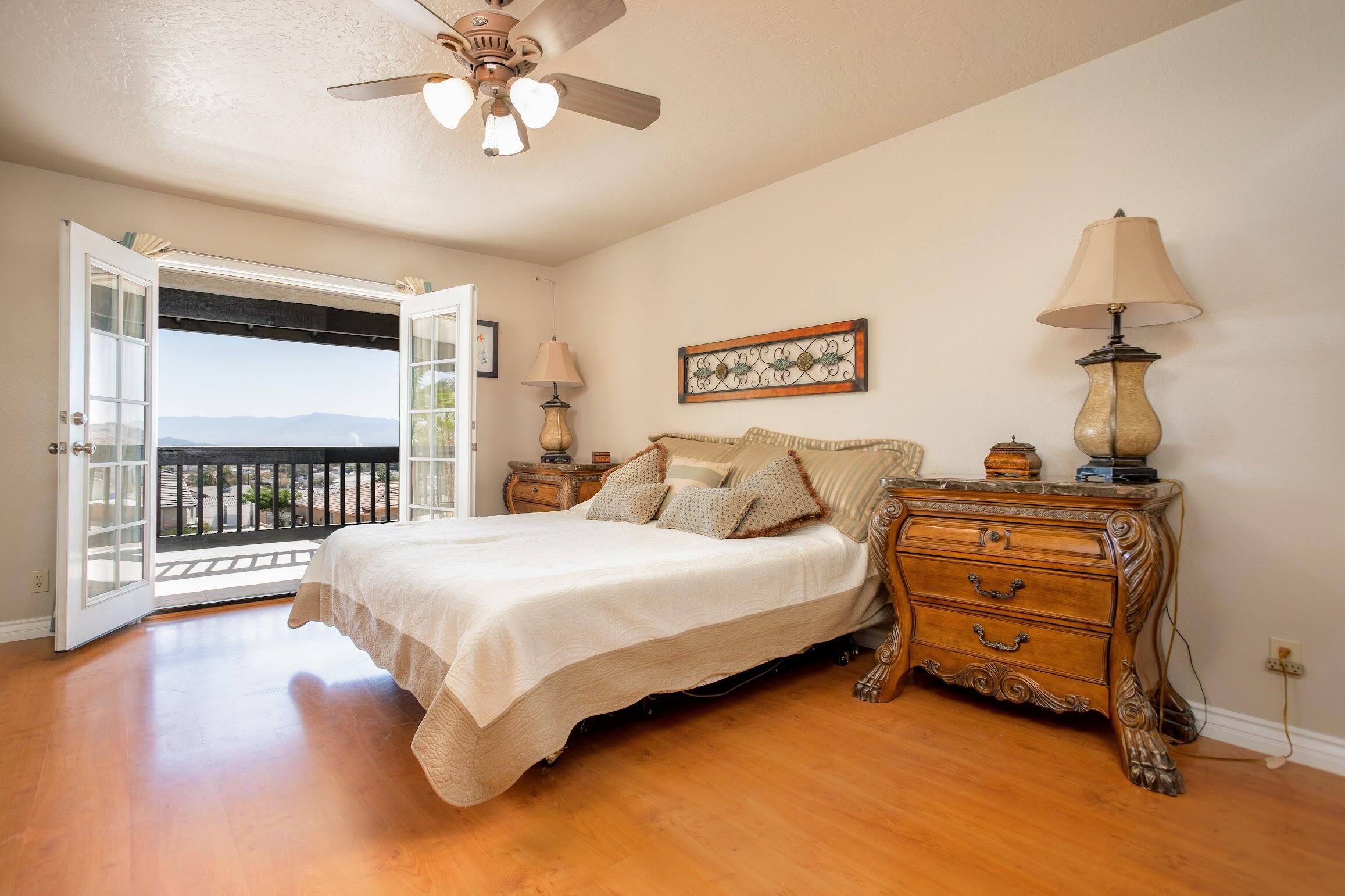 16276 Rancherias Road Apple Valley, CA 92307 - Photo 16 of 27 a bedroom with bed and a window