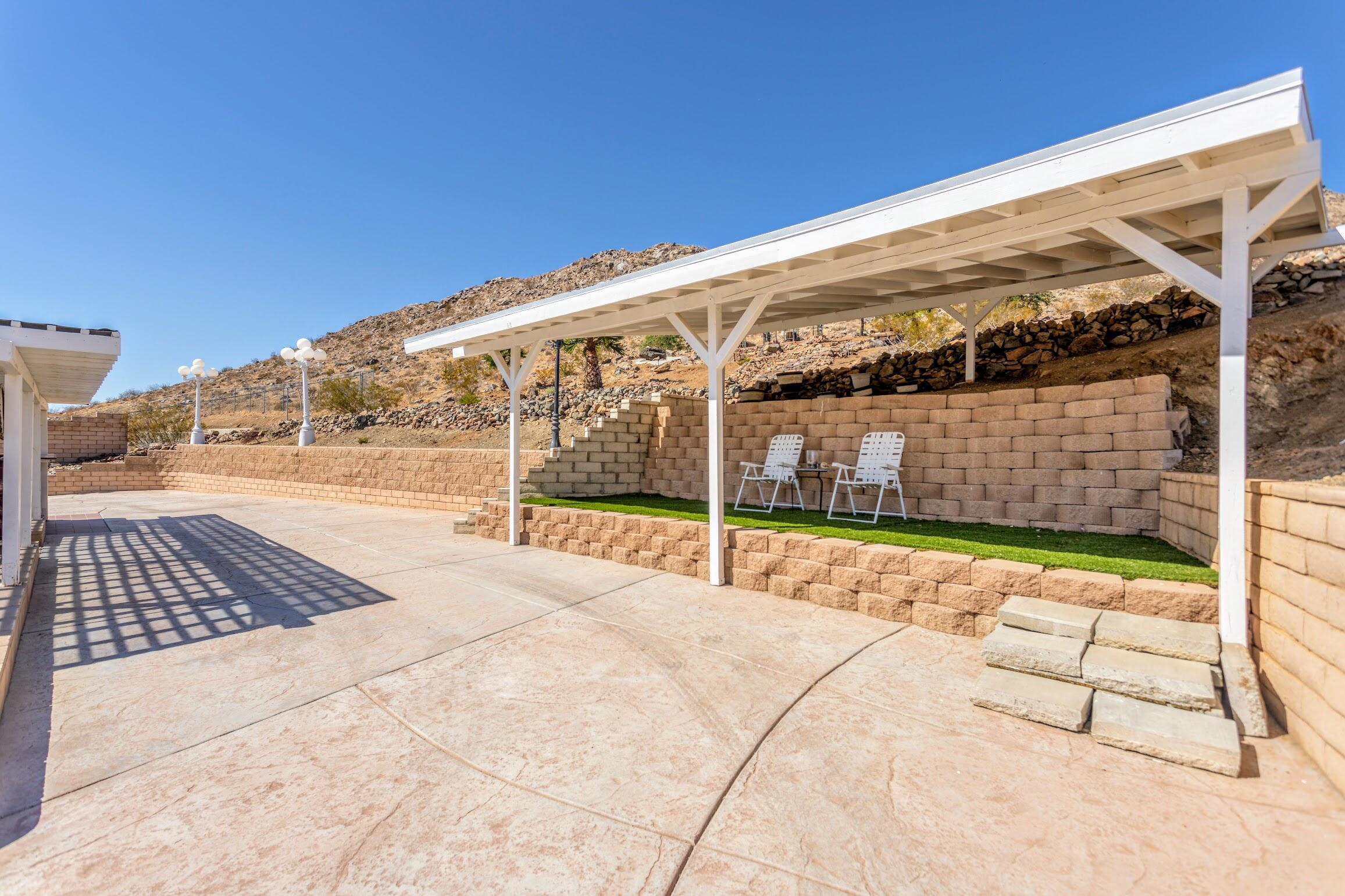 16276 Rancherias Road Apple Valley, CA 92307 - Photo 26 of 27 a view of house with backyard