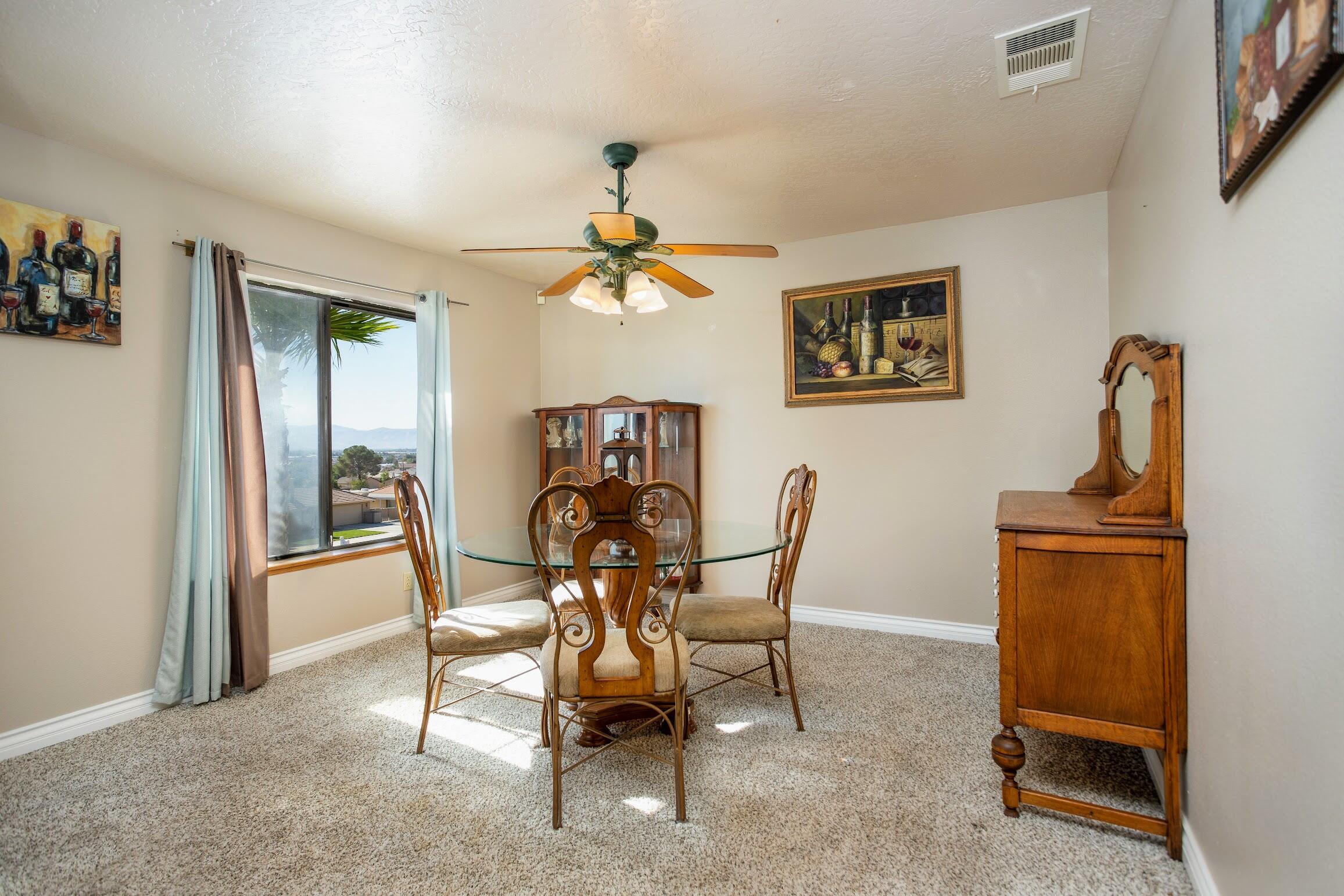16276 Rancherias Road Apple Valley, CA 92307 - Photo 8 of 27 a dining room with furniture and window
