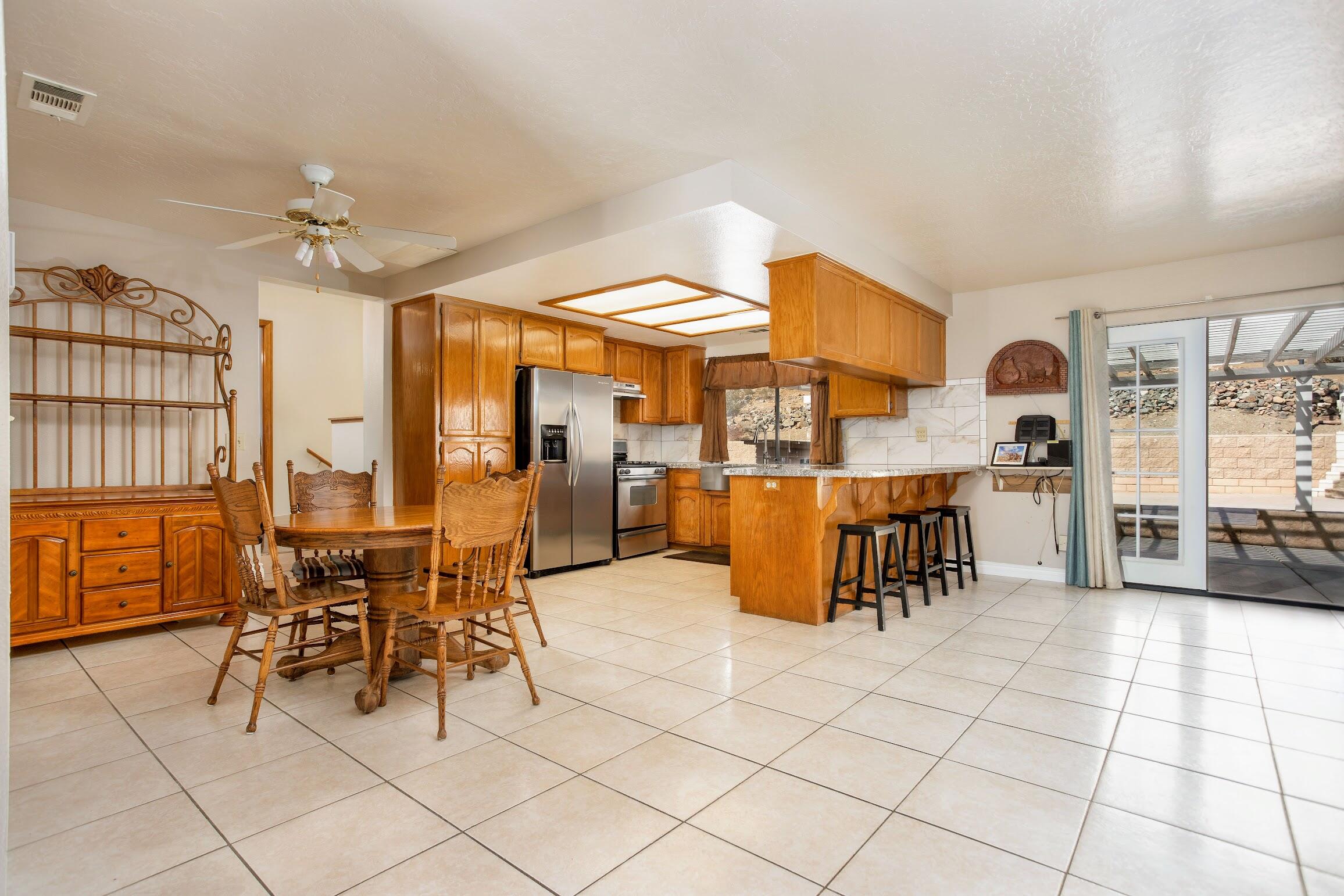 16276 Rancherias Road Apple Valley, CA 92307 - Photo 9 of 27 a view of a dining room with furniture