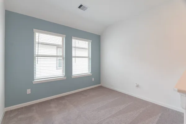 a kitchen with stainless steel appliances granite countertop a refrigerator a stove and a sink with wooden floor