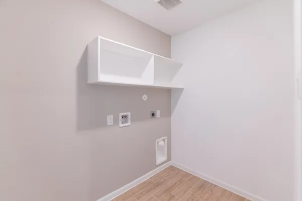 a bathroom with a double vanity sink mirror and shower