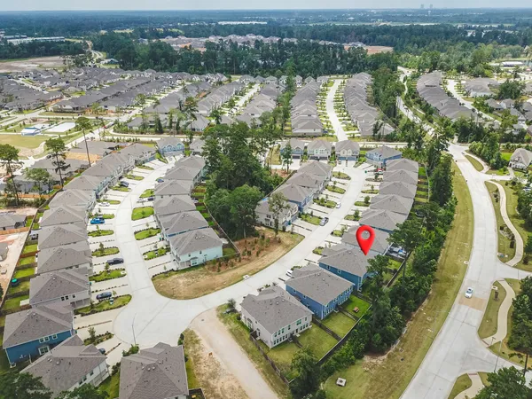 an aerial view of residential houses with outdoor space