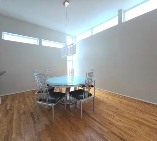 a bathroom with a granite countertop toilet sink and mirror