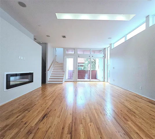 a view of hallway with wooden floor