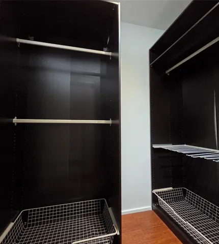 a bathroom with a granite countertop sink a toilet and bathtub