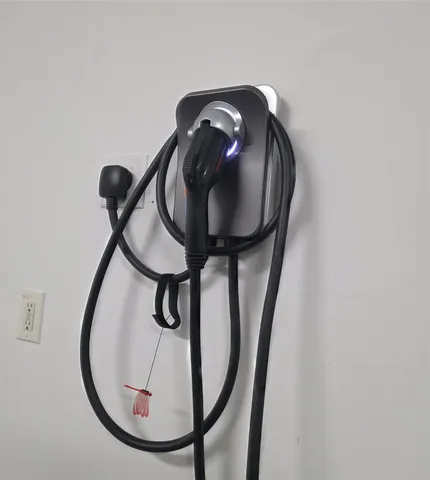 a close view of staircase with a mirror and a gate