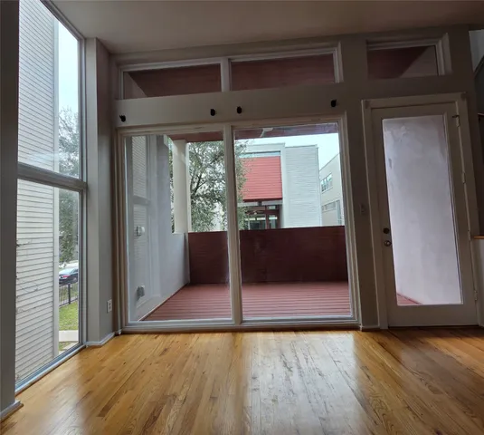 a view of a room with wooden floor