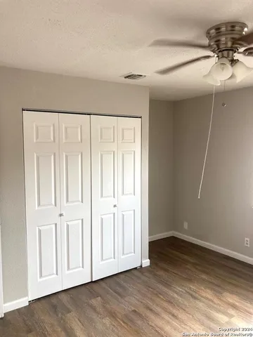 an empty room with wooden floor