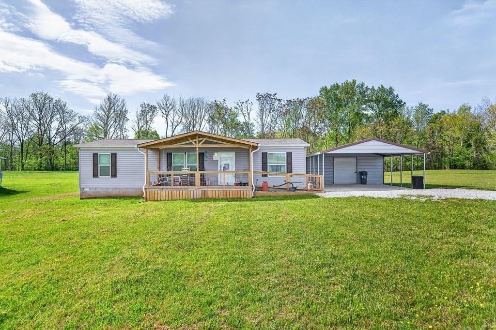 156 Falls View Road Sparta, TN 38583 - Photo 1 of 29 a front view of a house with yard and green space
