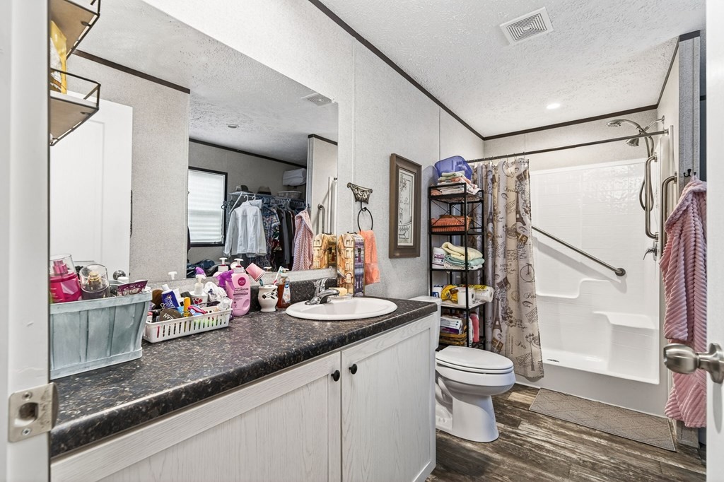 156 Falls View Road Sparta, TN 38583 - Photo 11 of 29 a bathroom with a sink a toilet and shower