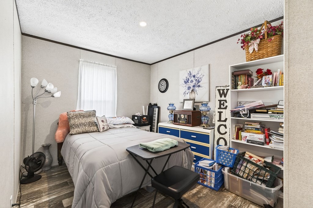 156 Falls View Road Sparta, TN 38583 - Photo 12 of 29 a bedroom with a bed and a book shelf