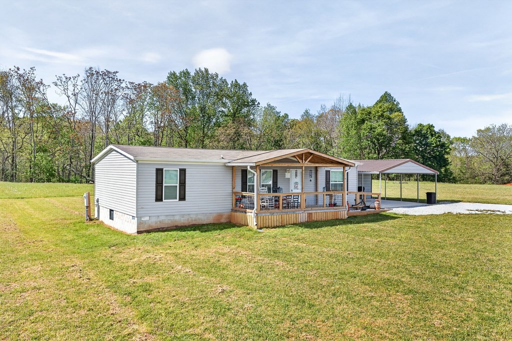 156 Falls View Road Sparta, TN 38583 - Photo 16 of 29 a view of a house with a yard and sitting area