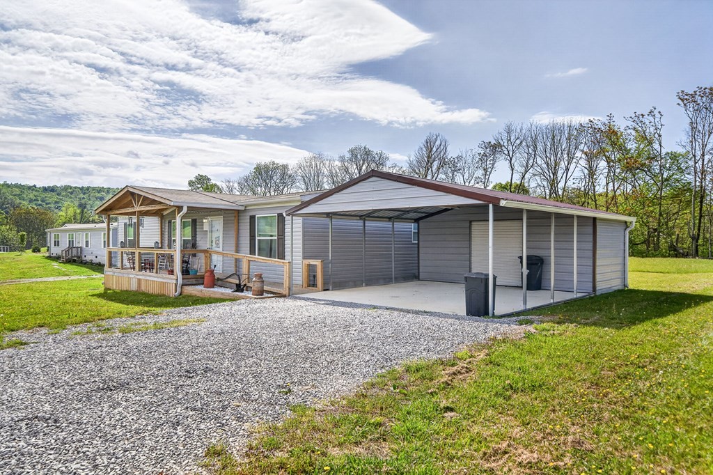 156 Falls View Road Sparta, TN 38583 - Photo 19 of 29 a front view of a house with garden