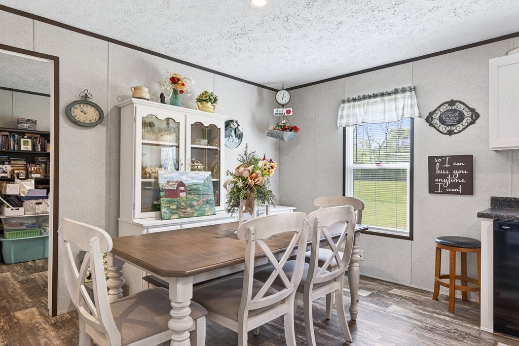 156 Falls View Road Sparta, TN 38583 - Photo 4 of 29 a view of a dining room with furniture large window and wooden floor