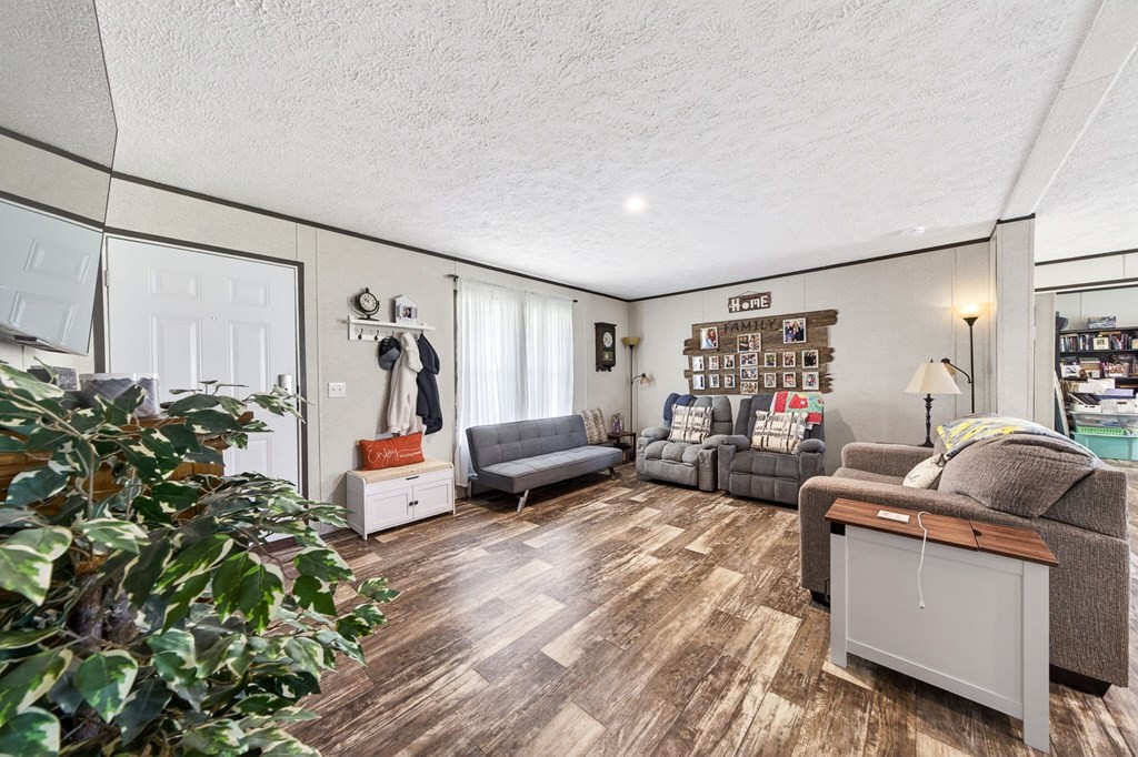 156 Falls View Road Sparta, TN 38583 - Photo 6 of 29 a living room with furniture and a potted plant