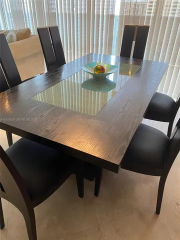 a living room with furniture a rug and a window