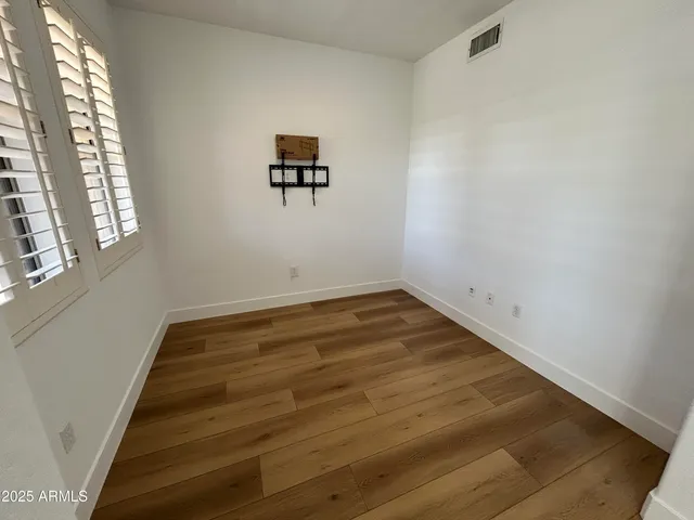 a view of empty room with windows