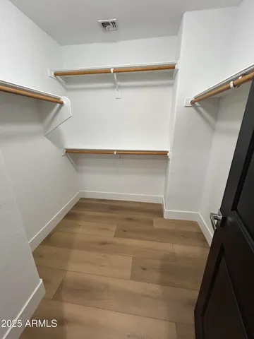 a view of a livingroom with a ceiling fan and window