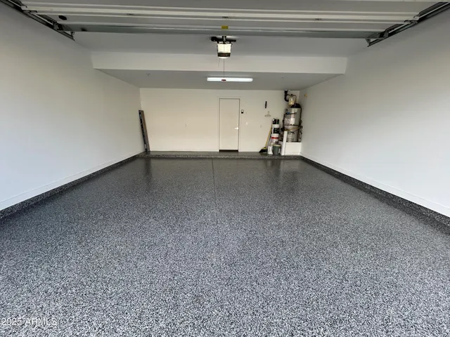 a view of a house with backyard patio and swimming pool