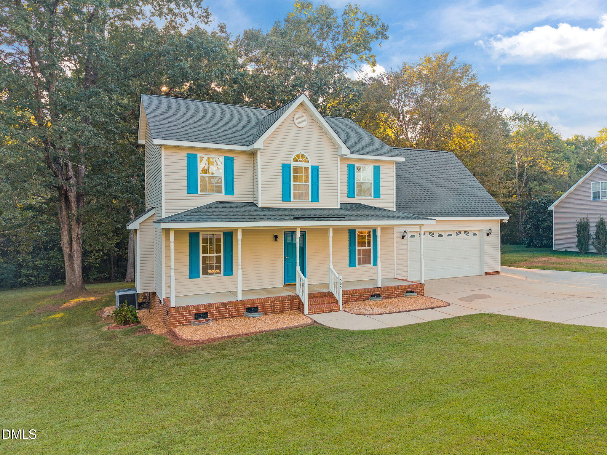 505 Vinson Road Clayton, NC 27527 - Photo 4 of 31 a front view of a house with a yard