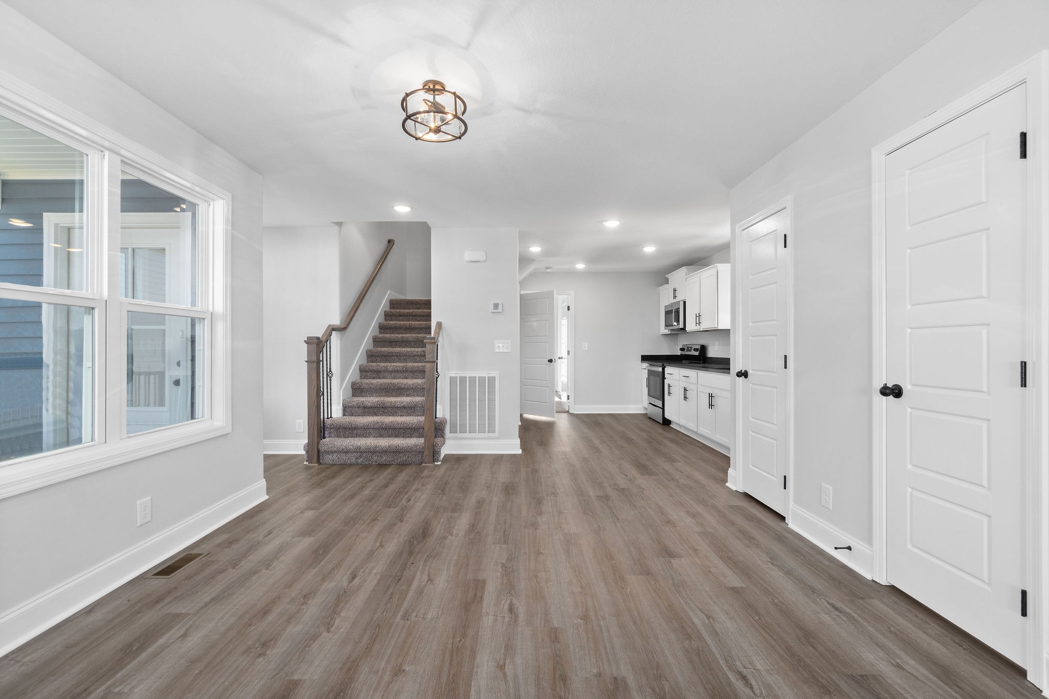 64 West High Street Clarksville, TN 37040 - Photo 7 of 22 a view of a room with wooden floor and stairs