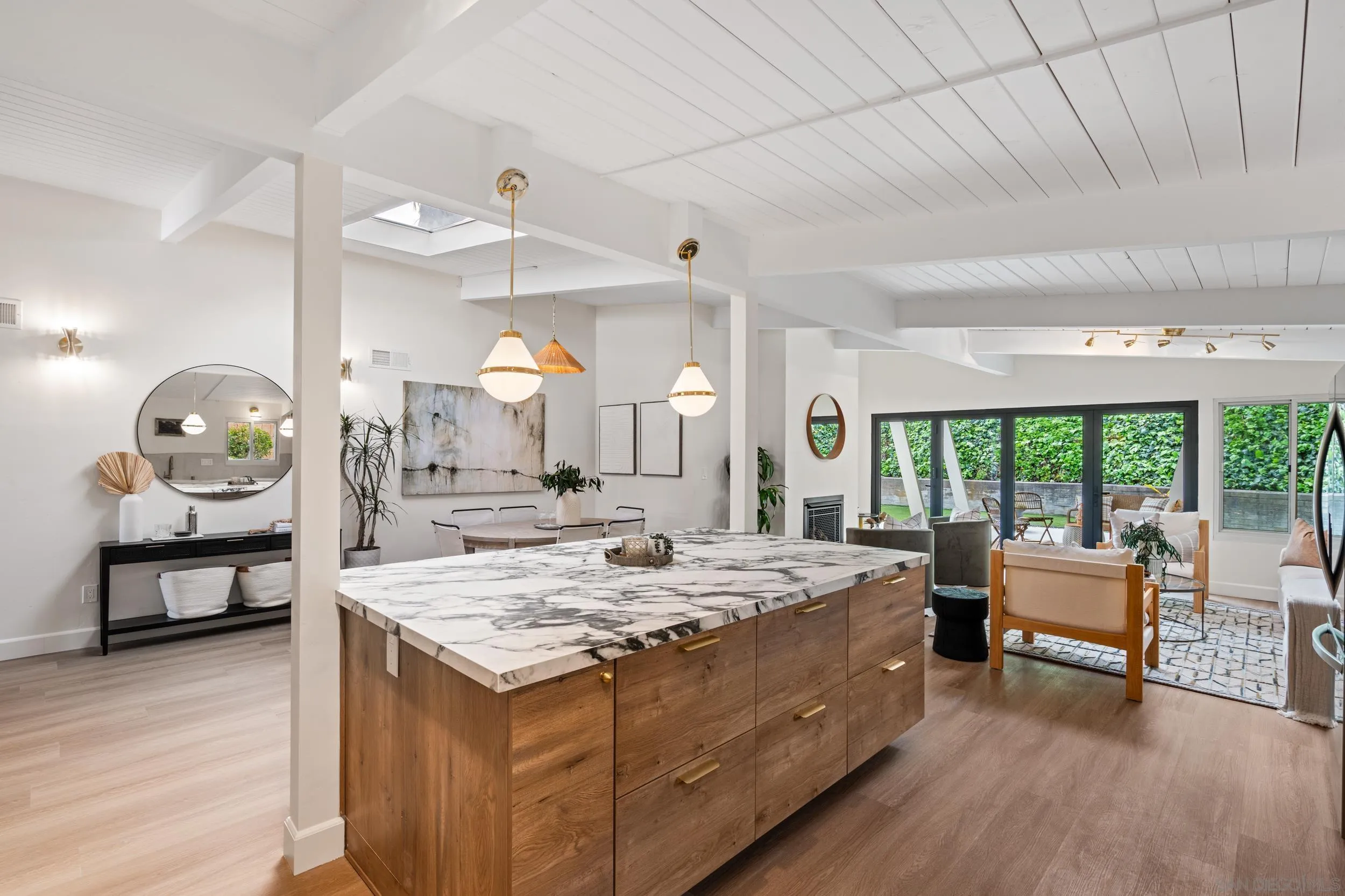 3448 Larga Circle San Diego, CA 92110 - Photo 11 of 36 a living room with stainless steel appliances granite countertop furniture and a wooden floor