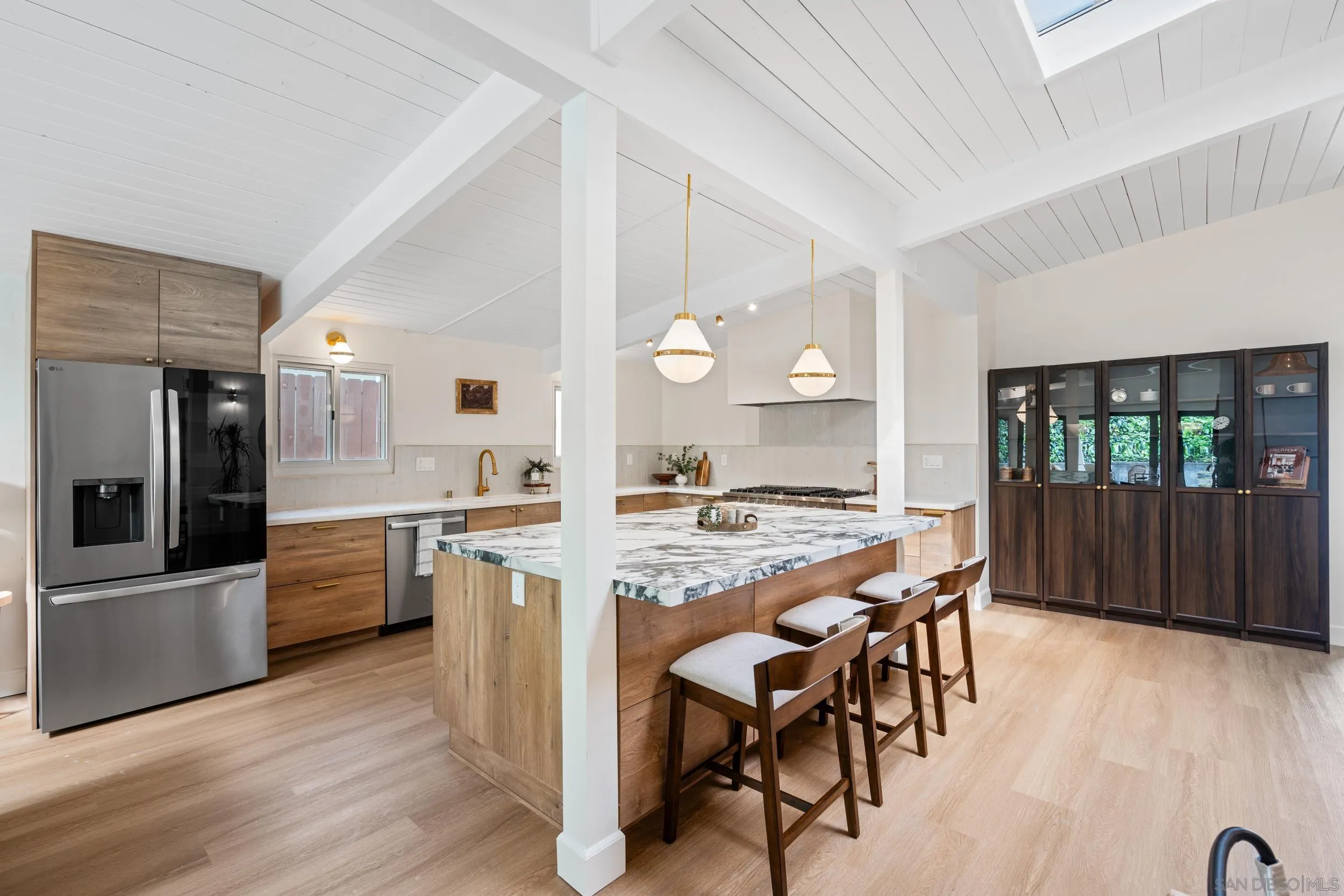 3448 Larga Circle San Diego, CA 92110 - Photo 12 of 36 a large kitchen with a table and chairs in it