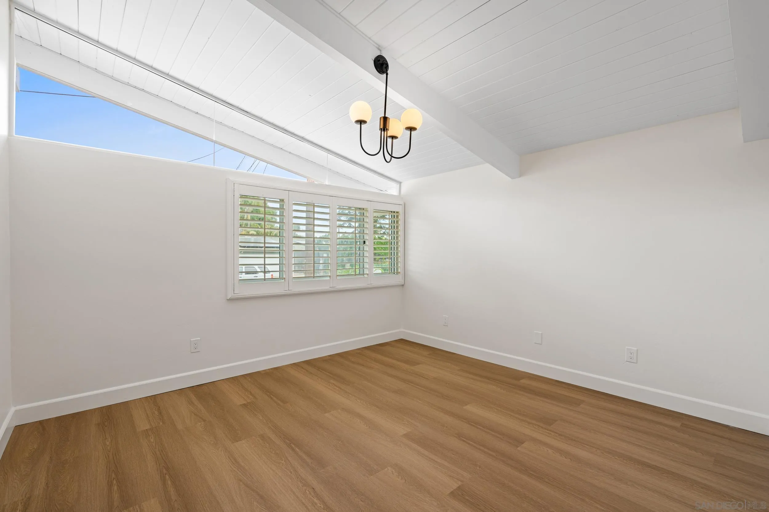 3448 Larga Circle San Diego, CA 92110 - Photo 20 of 36 wooden floor in an empty room with a window