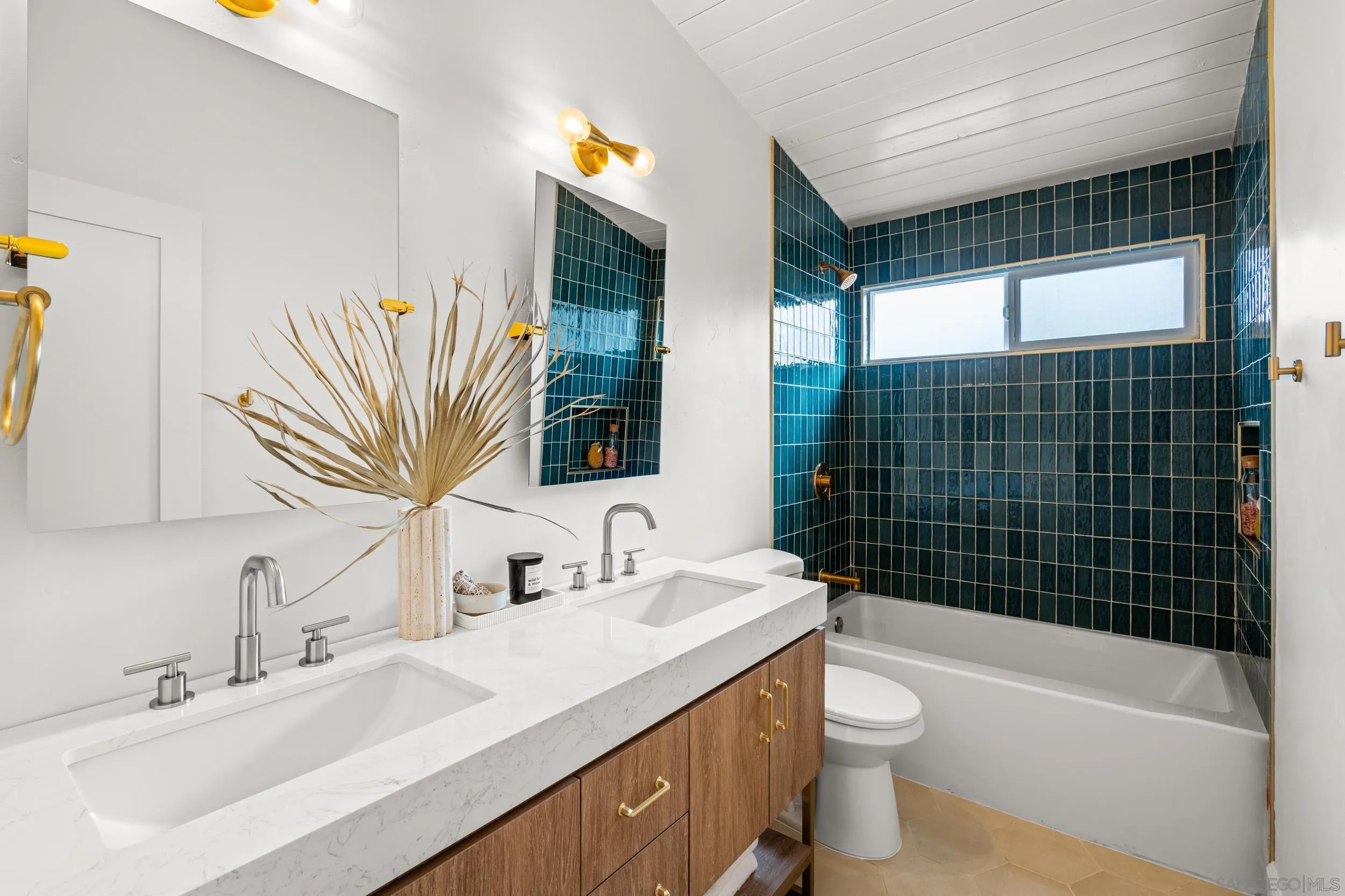 3448 Larga Circle San Diego, CA 92110 - Photo 23 of 36 a bathroom with a sink a toilet and shower