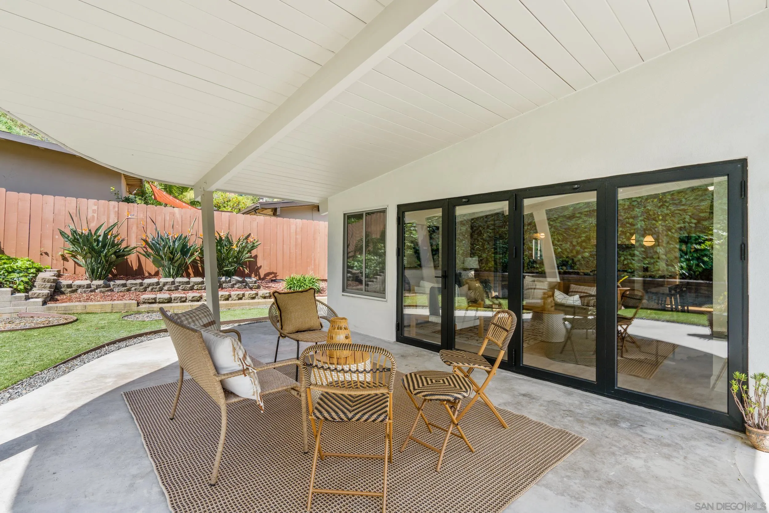 3448 Larga Circle San Diego, CA 92110 - Photo 24 of 36 a view of a patio with a dining table and chairs