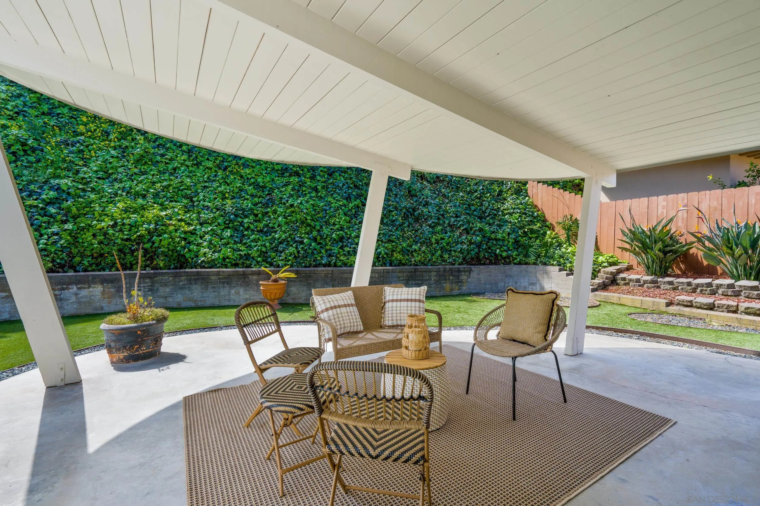 3448 Larga Circle San Diego, CA 92110 - Photo 26 of 36 a view of an outdoor sitting area with furniture and garden view