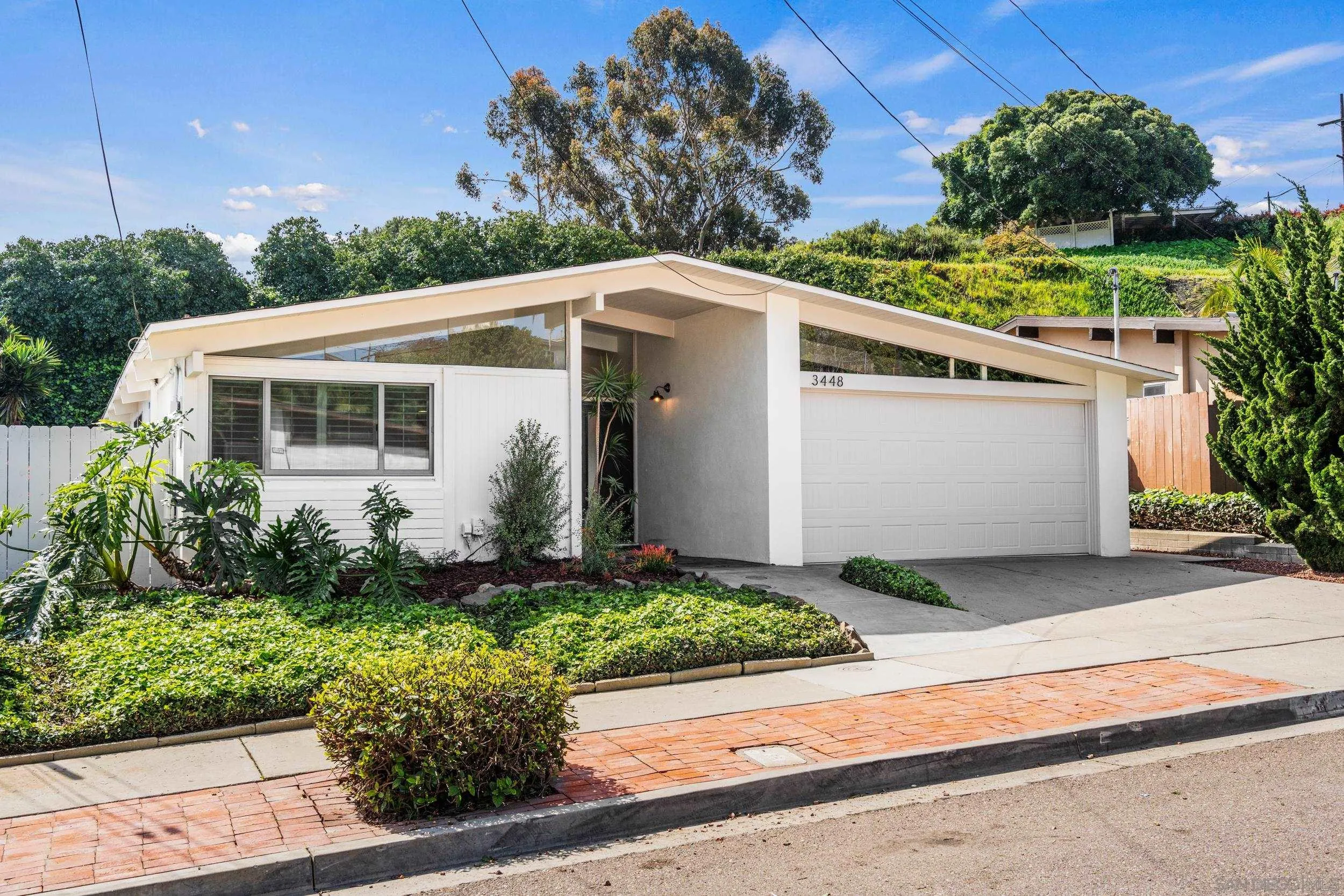 3448 Larga Circle San Diego, CA 92110 - Photo 30 of 36 a front view of a house with a yard