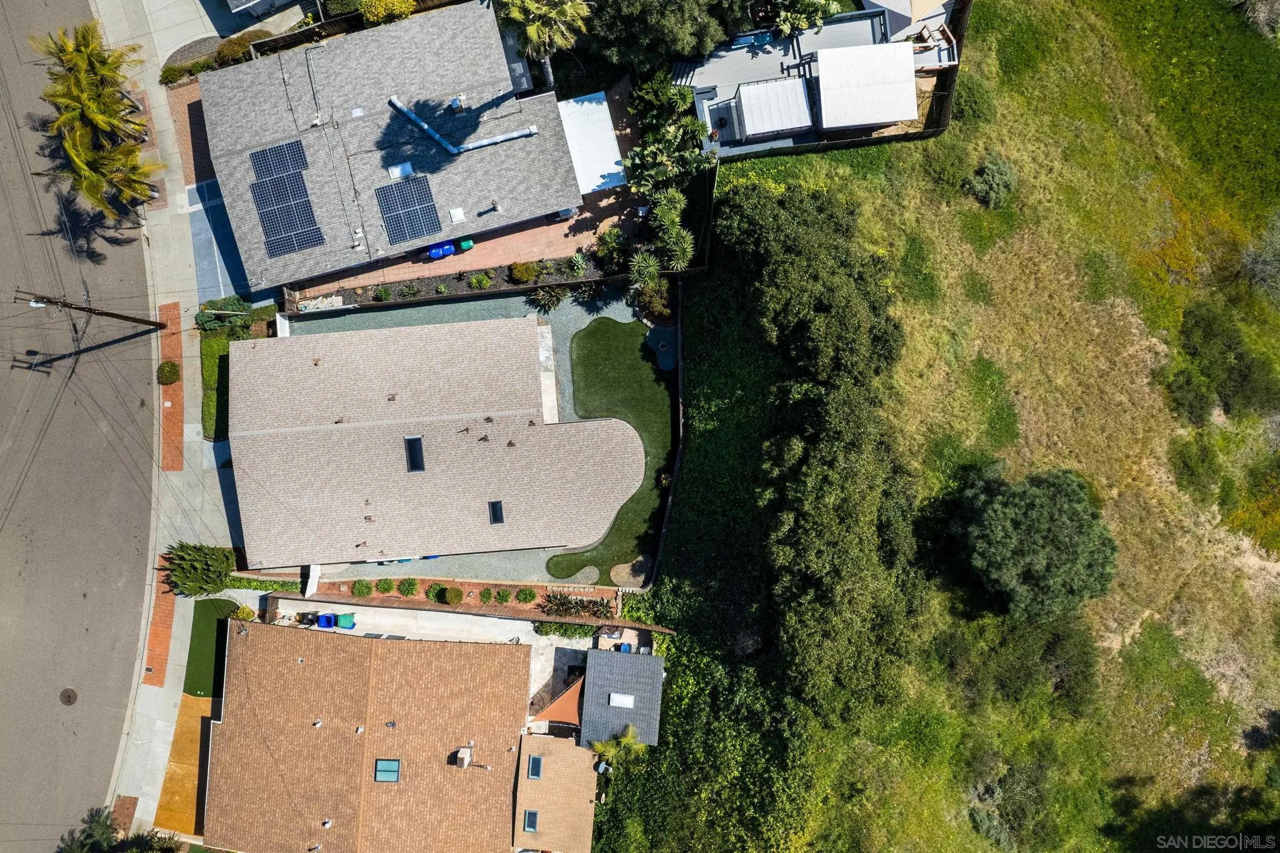 3448 Larga Circle San Diego, CA 92110 - Photo 33 of 36 an aerial view of residential house with outdoor space and trees