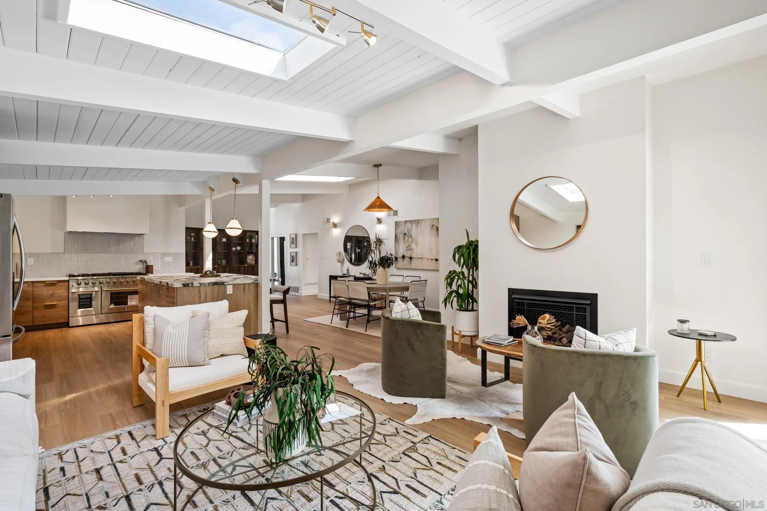 3448 Larga Circle San Diego, CA 92110 - Photo 6 of 36 a living room with furniture kitchen view and a fireplace