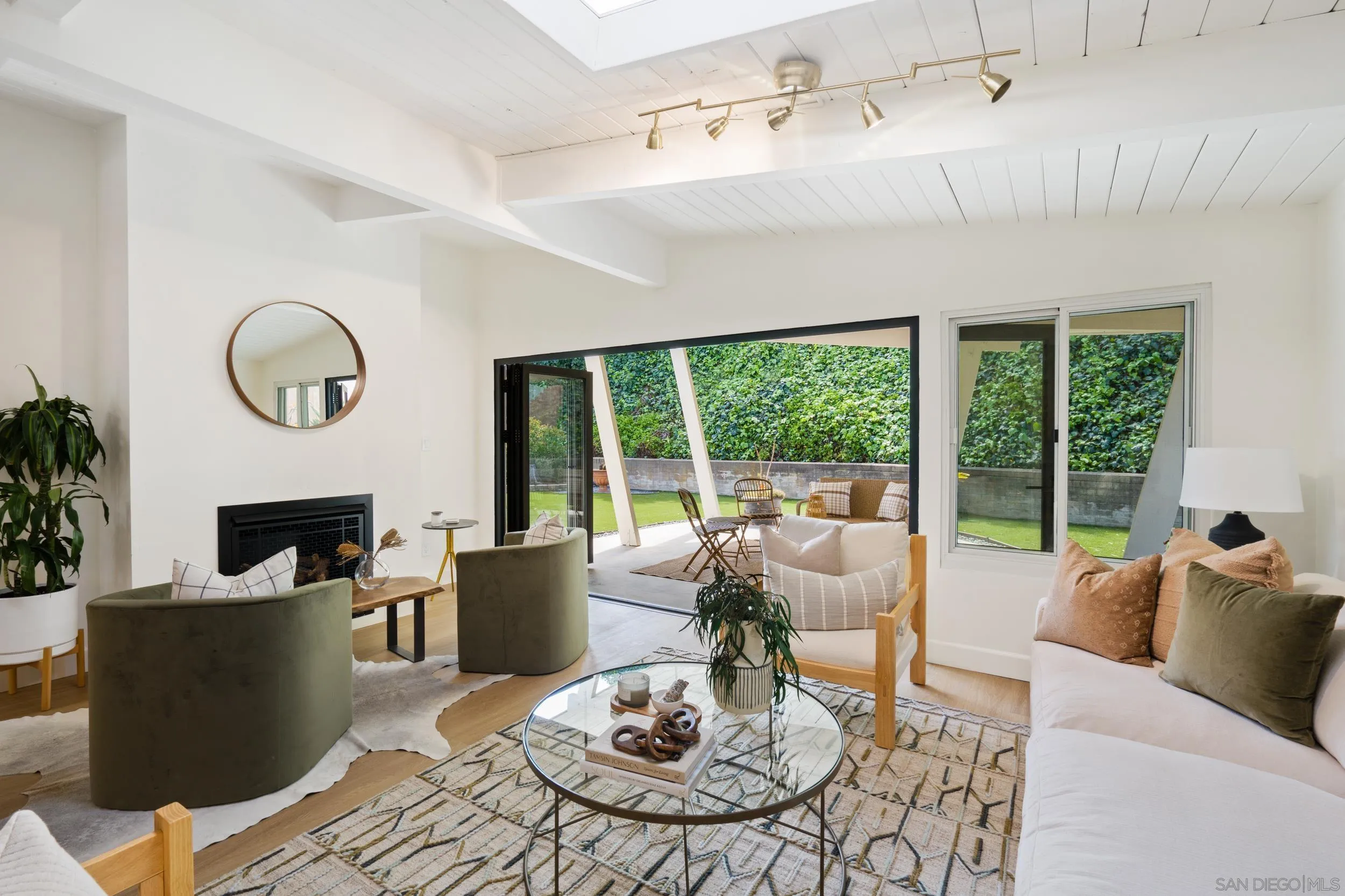 3448 Larga Circle San Diego, CA 92110 - Photo 7 of 36 a living room with fireplace furniture and a large window