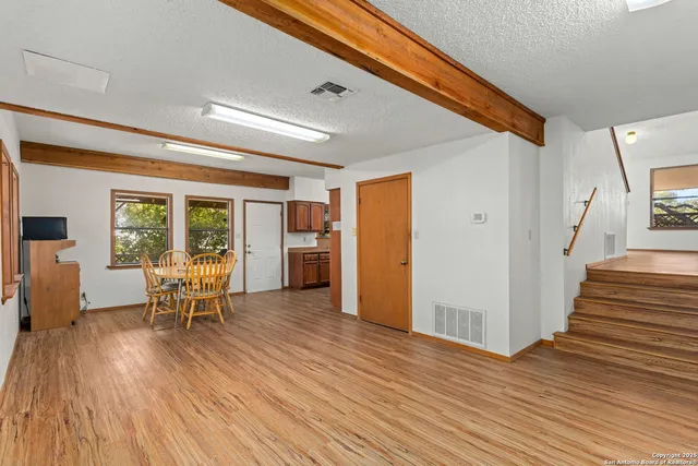 a view of a livingroom with furniture and wooden floor