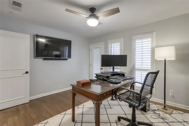 a view of a livingroom with furniture and a flat screen tv