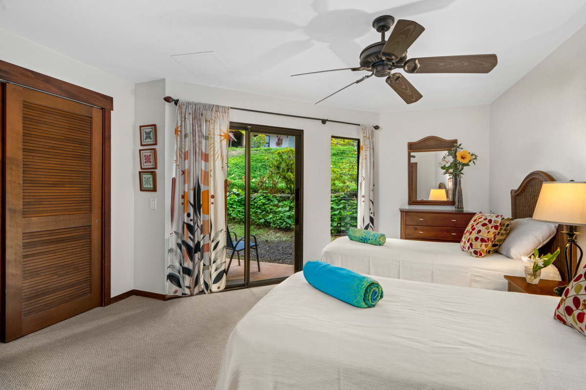 1870 Hoone Road, Unit 602 Koloa, HI 96756 - Photo 19 of 26 a bedroom with a bed and ceiling fan